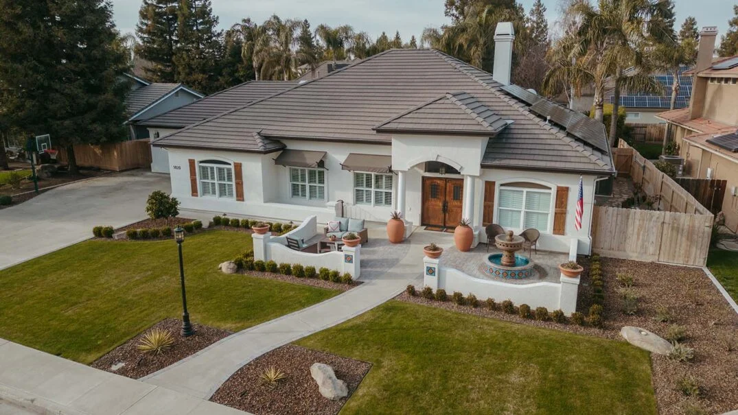 Aerial view of a modern house with landscaped yard