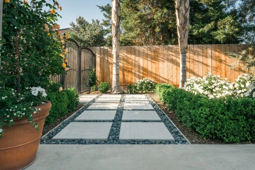 Pathway in a garden with flowers and greenery