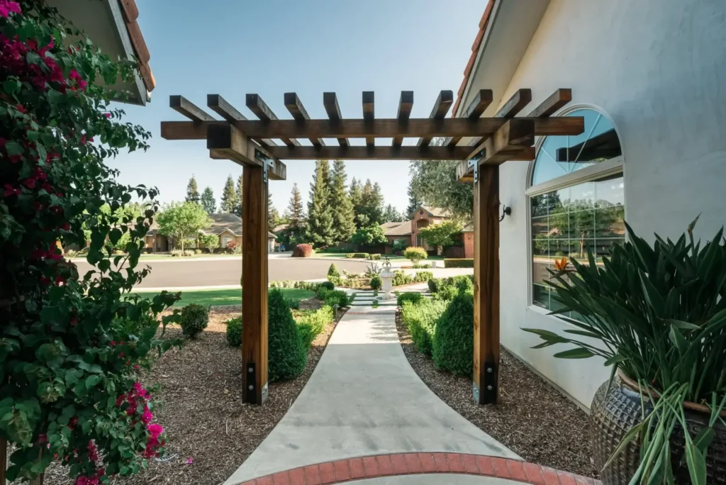 Wooden pergola in a landscaped garden