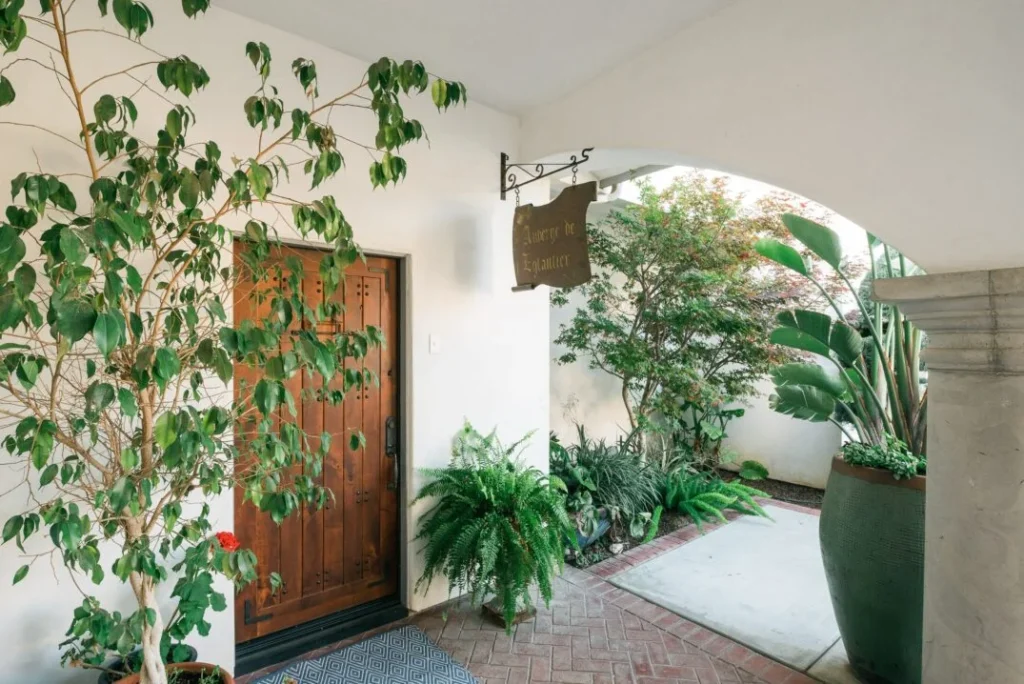 Entrance of a Spanish-style residence with plants