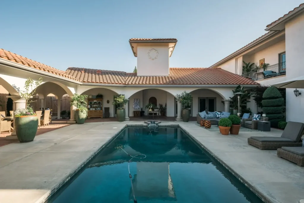 Spanish-style residence with pool and landscaped courtyard