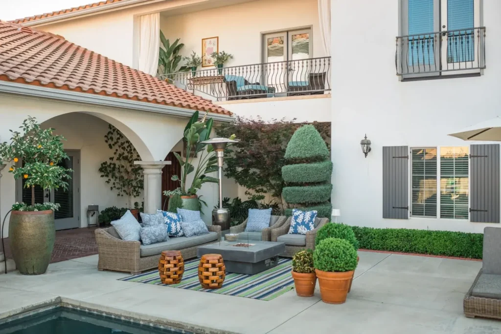 Traditional patio with seating and greenery at Anderson Residence